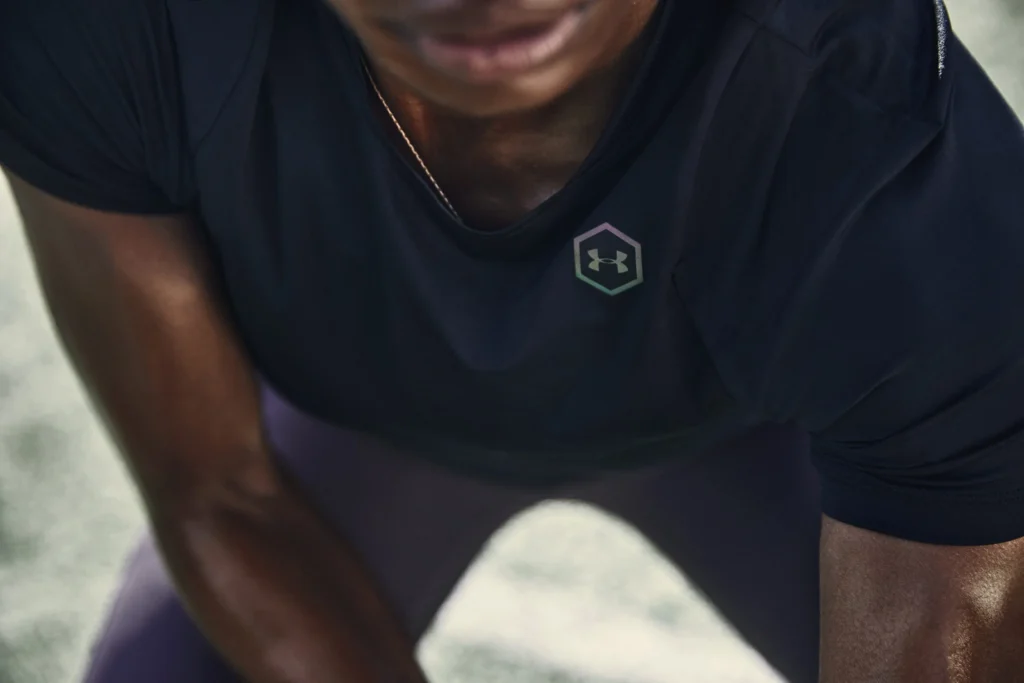 Close-up of a man wearing a shirt with the Under Armor logo