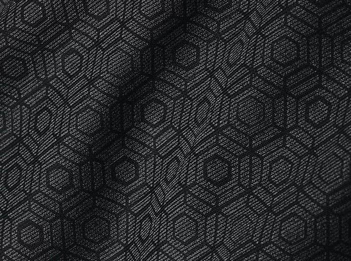 Close-up of black fabric with hexagon pattern