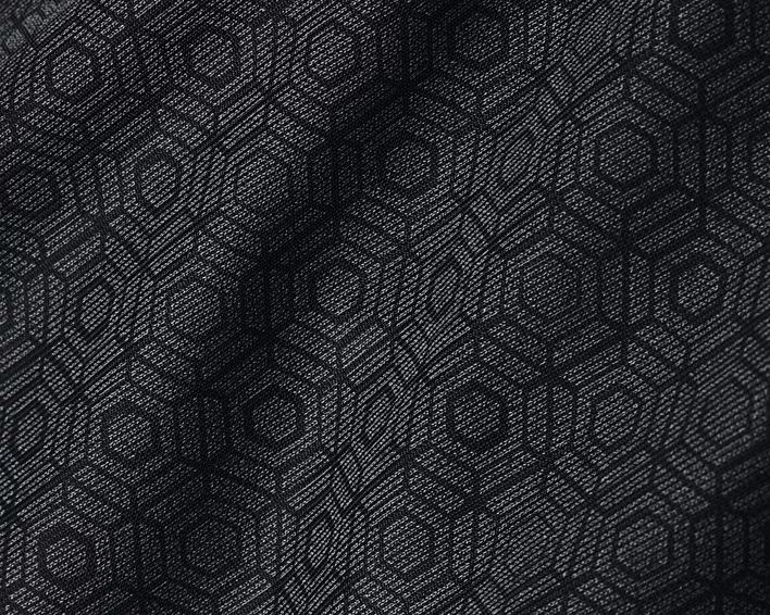 Close-up of black fabric with hexagon pattern