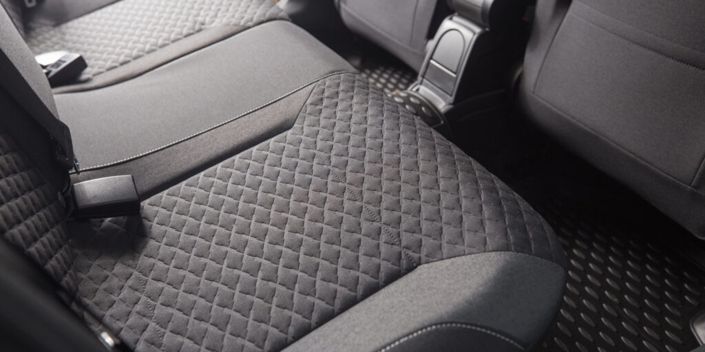 Quilted black car seat with textured upholstery and a modern interior design